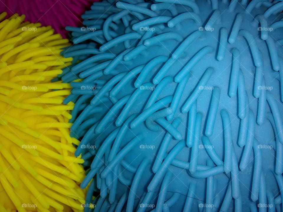 looks like corals, rubber strings, colorful, sensory, ticklish