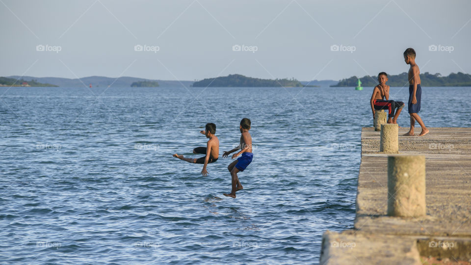 Children jumping and swim