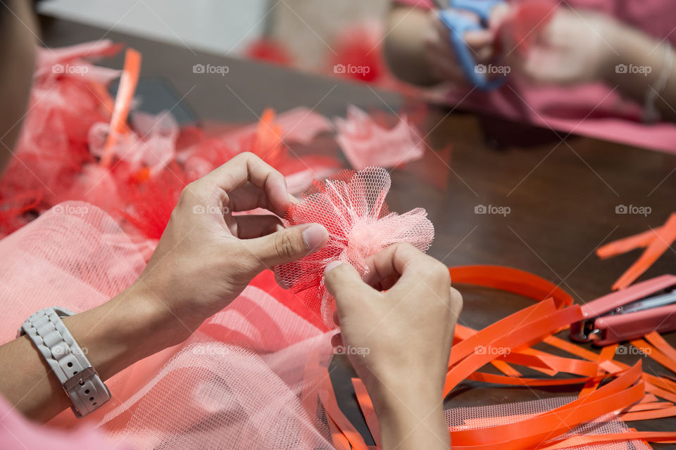 Person making flower deco