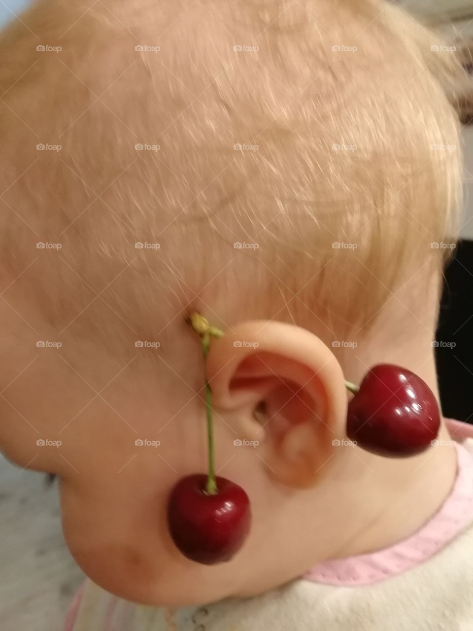 Baby and cherry