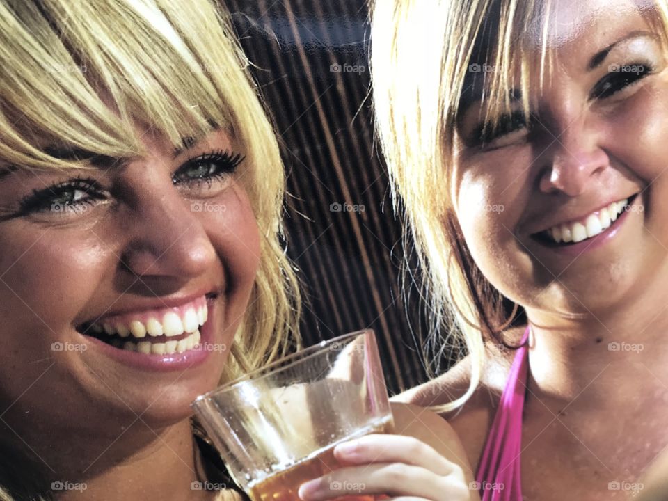 Smiling is a natural phenomenon for these two girls, aided by the bubbly l would suggest.