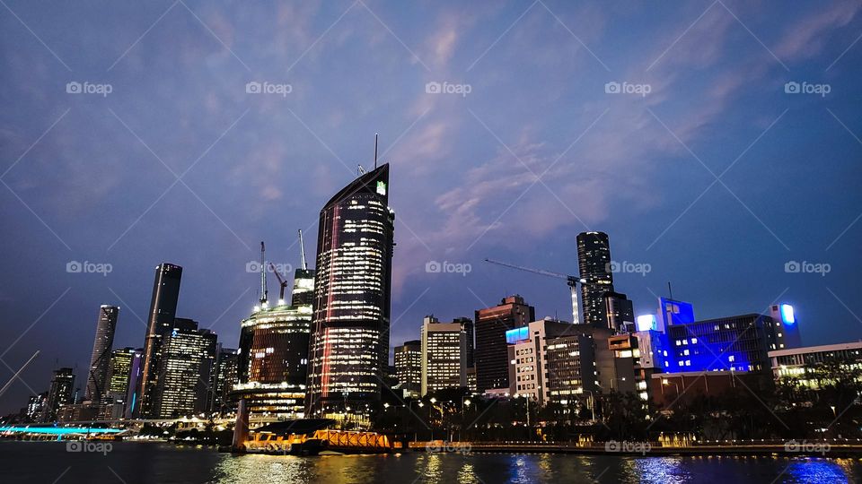Brisbane city skyline at night from the river