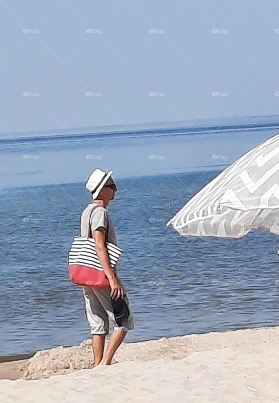 walking on the beach  on hot sunny day