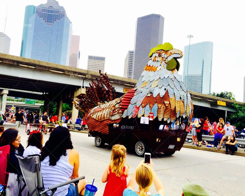 The big chicken strolling around . Chicken car 