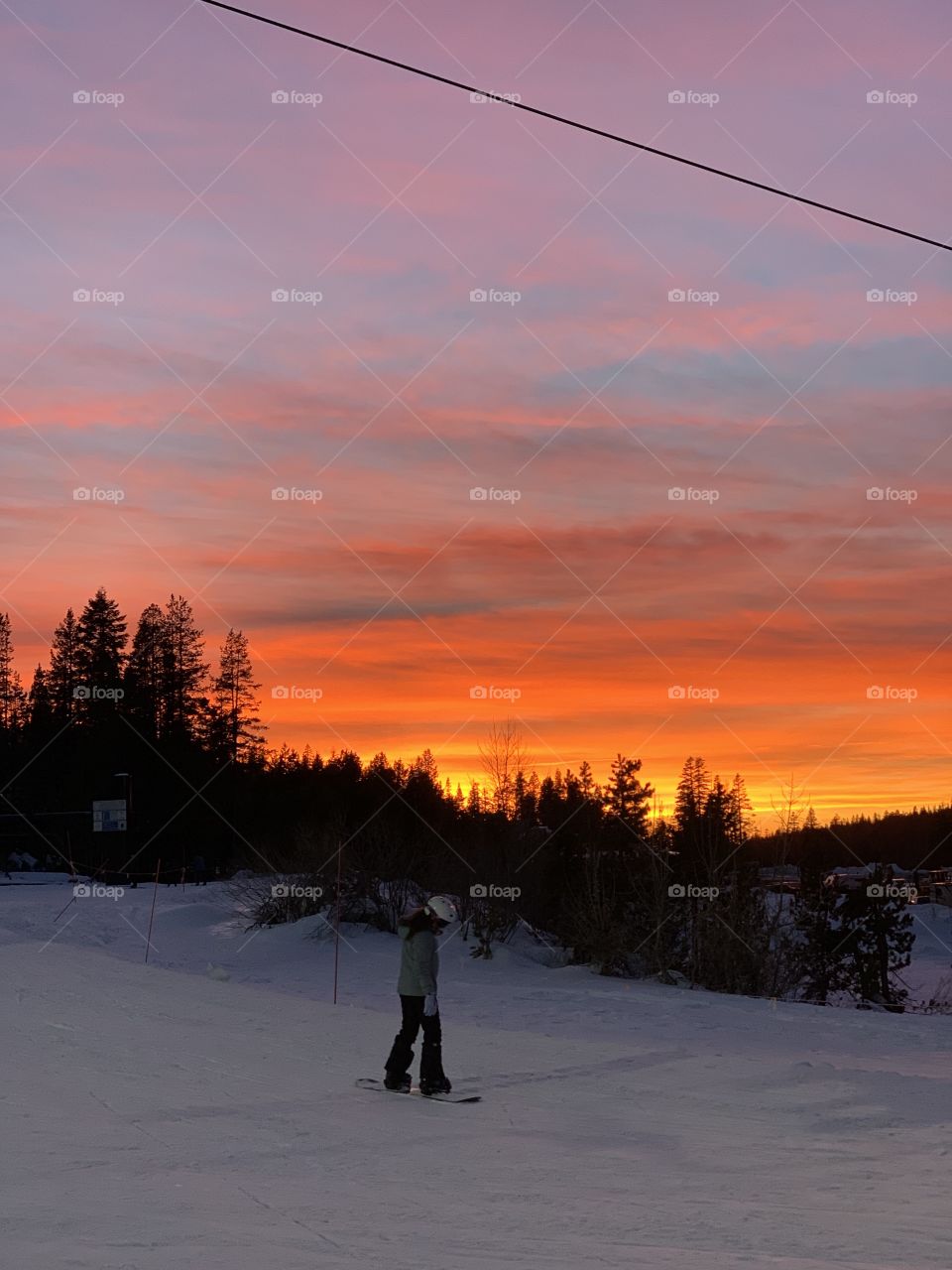 Beautiful California sunset with snowboarding