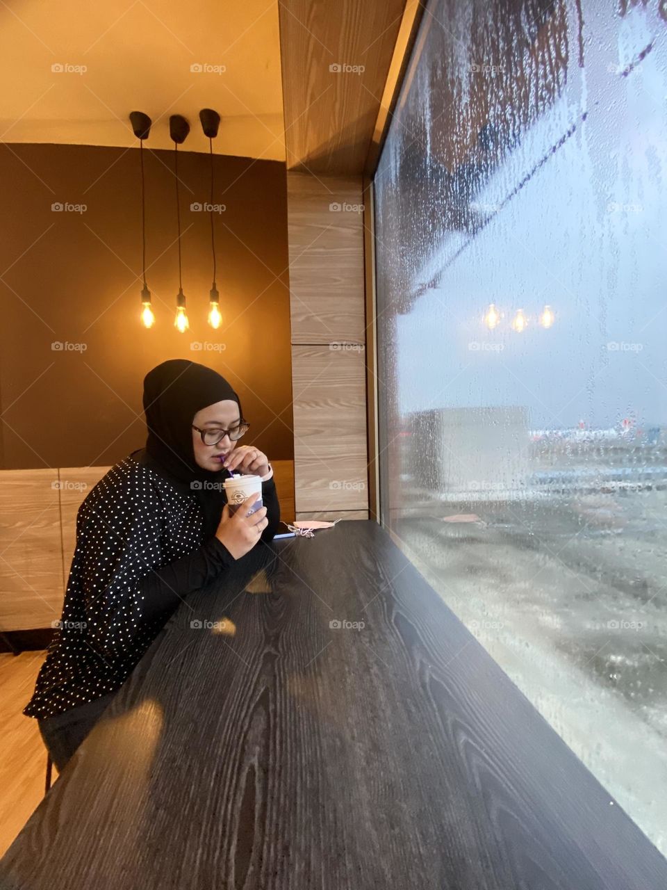 early morning coffee in front of the window