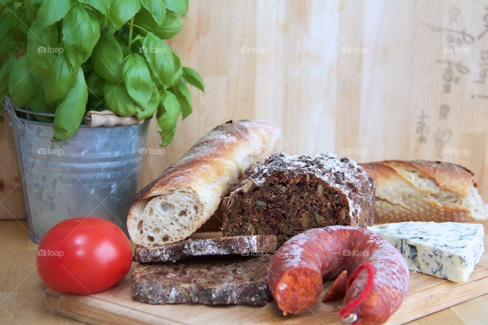 Food (bread, sausage, basil, lovage)
