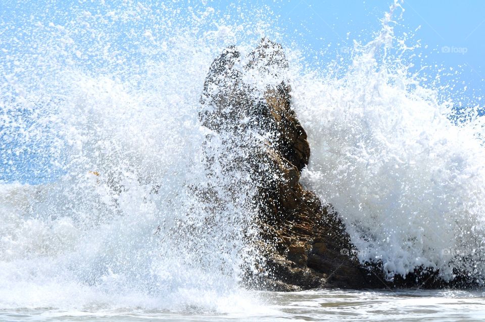 Waves crashing on the rock