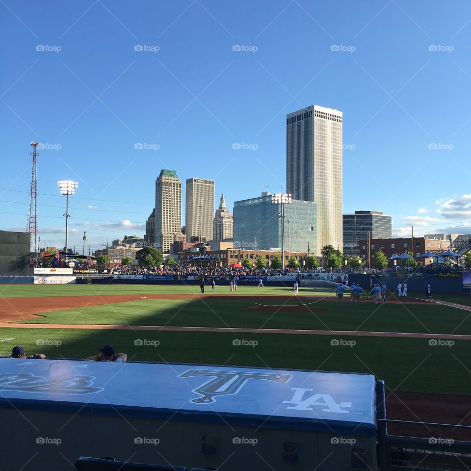 Sunset over the Tulsa skyline from a drillers game 