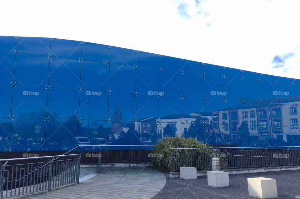 Reflection of the town in the glass