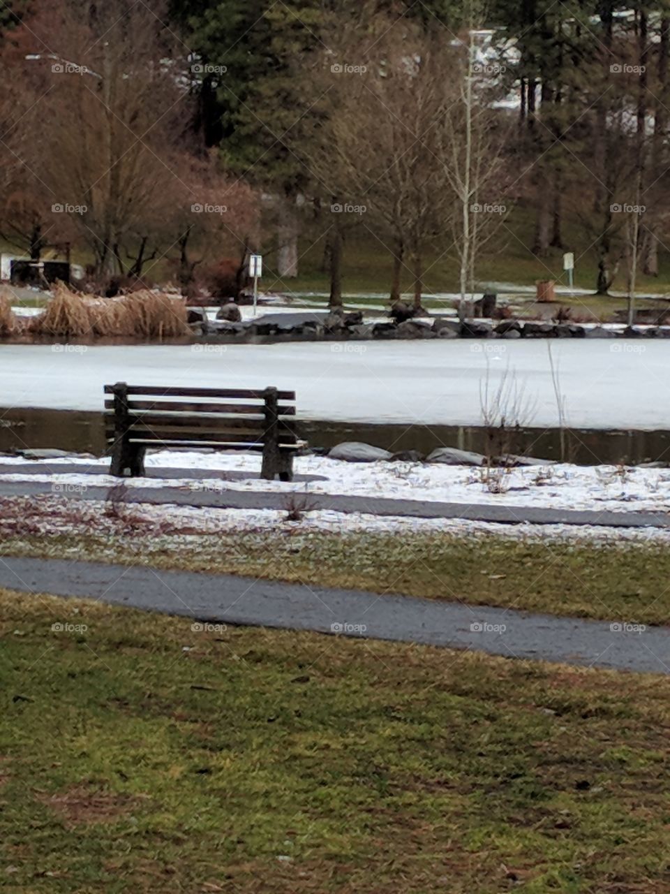 Lonely park bench on a wintery day