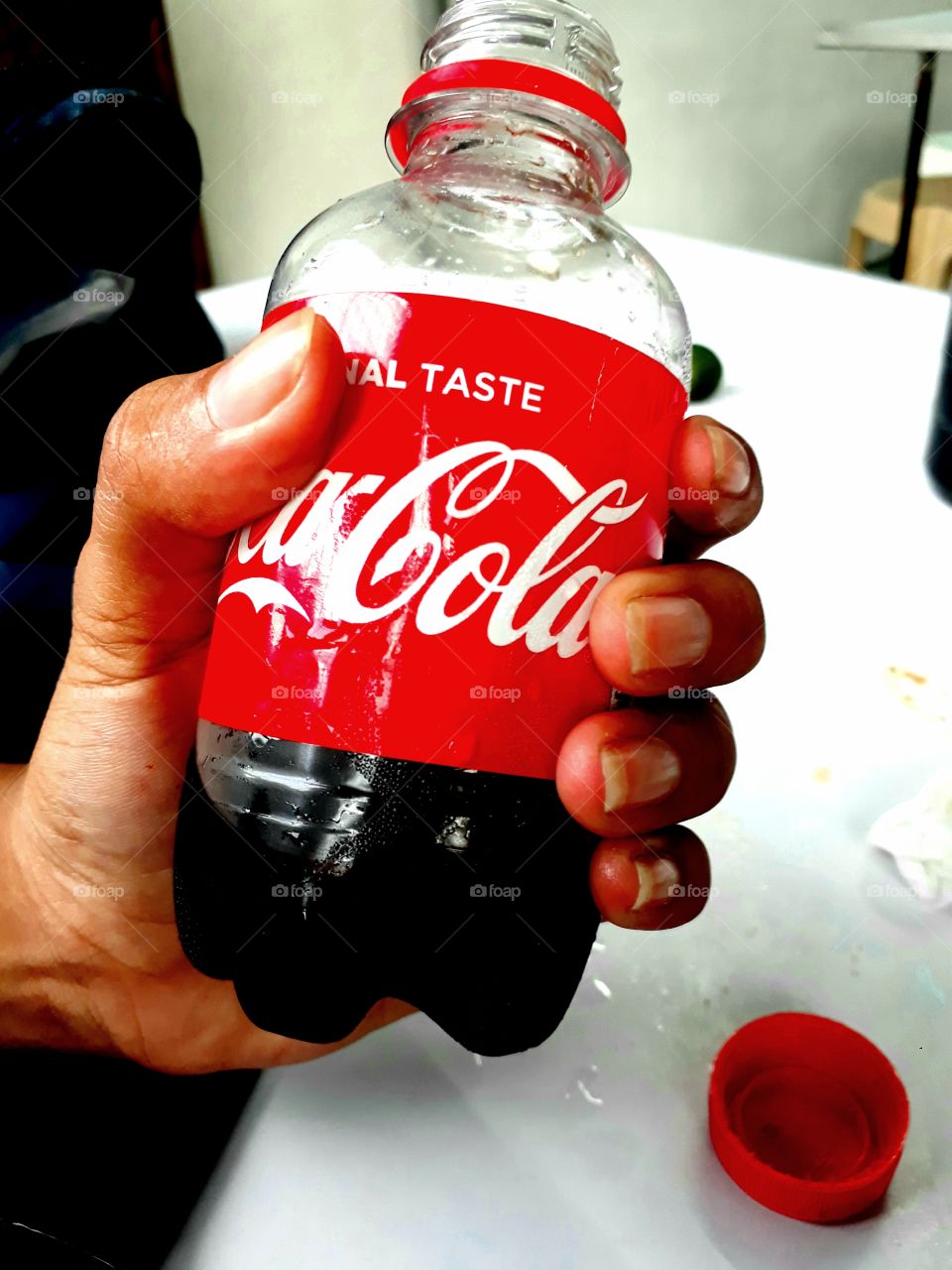 holding coca cola