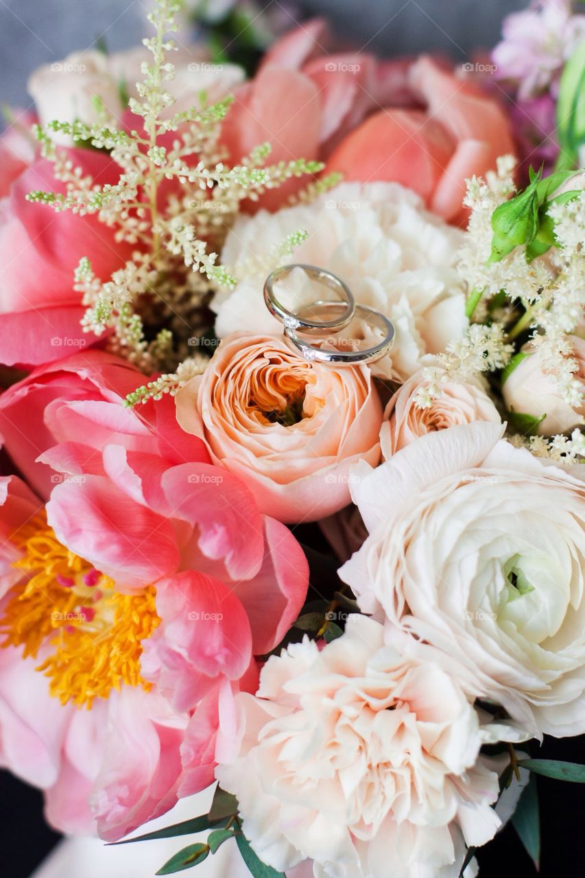 Wedding rings on flowers 