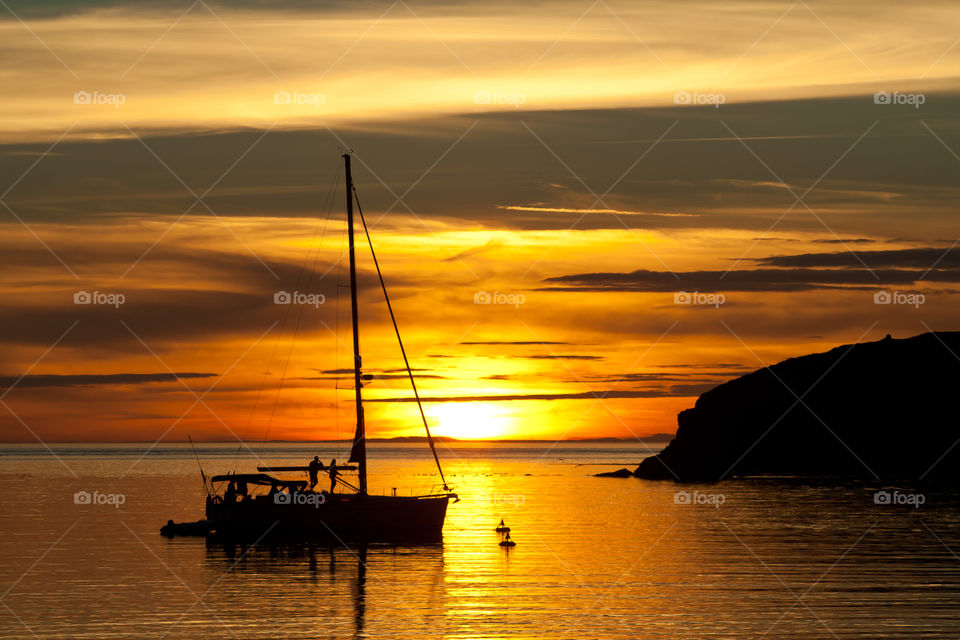 Silhouette of sailboat with tourist in pacific ocean