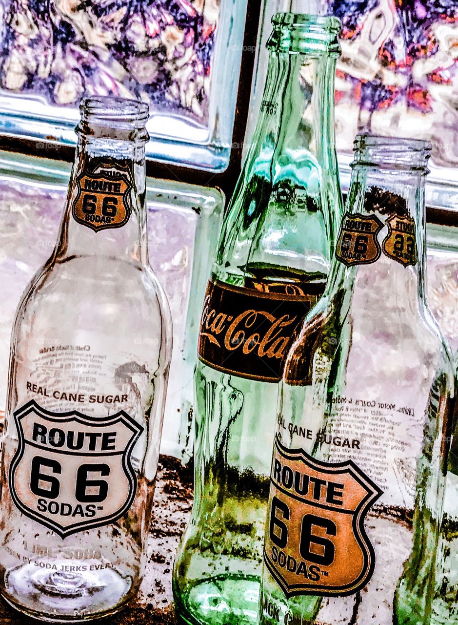 Glass bottles in the glass block window. 