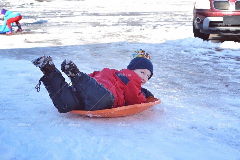 Sledding toddler 