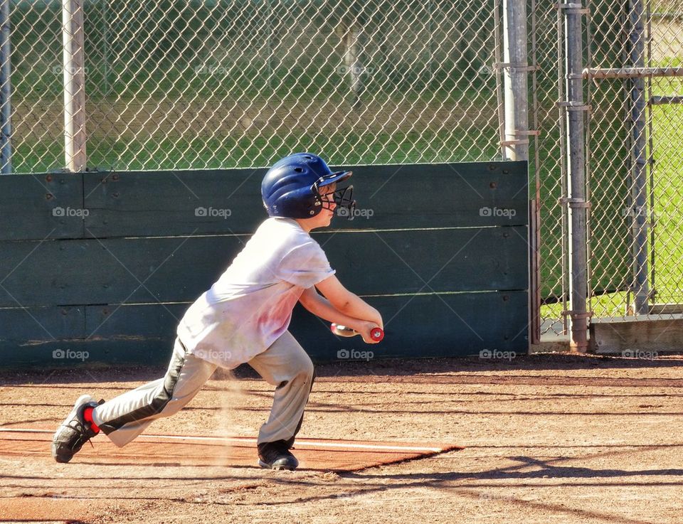 Young Baseball Player Taking A Swing