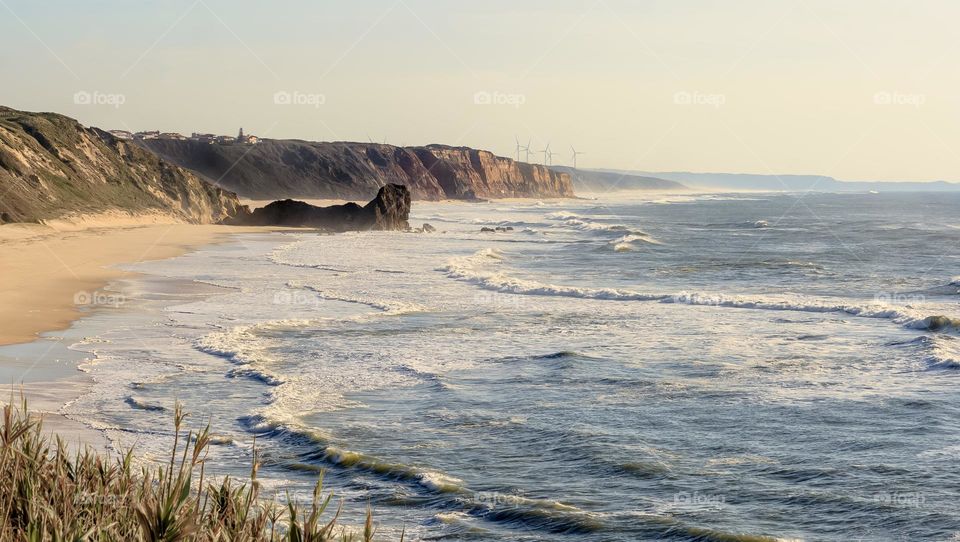 Praia da Polvoeira on Portugal’s west coast, the rock Castelo/Leão can be made out at the end of the beach