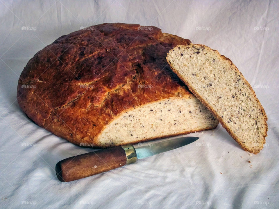 Home made bread with knife.
