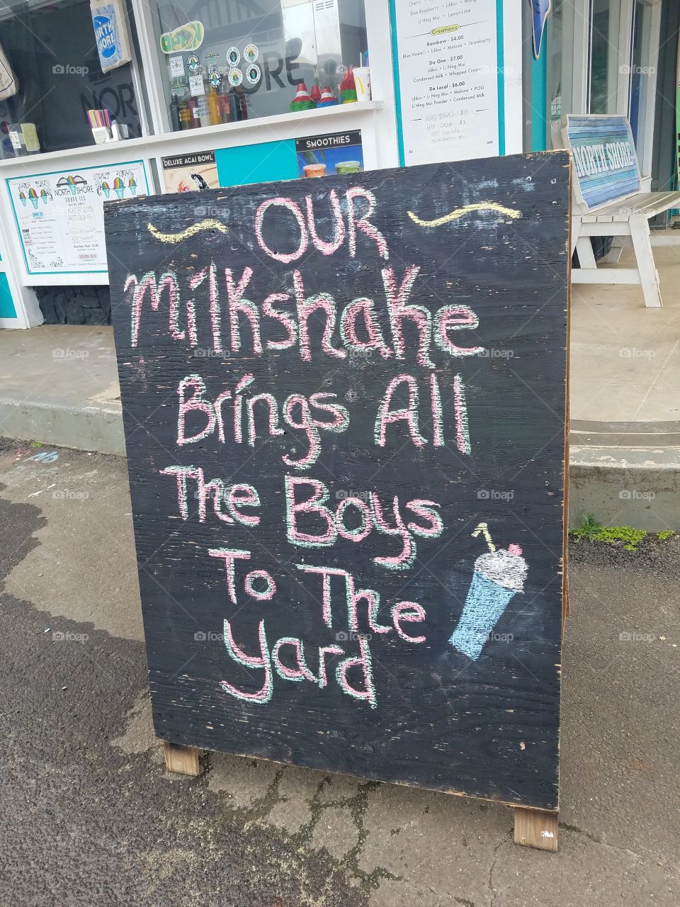 Sign outside shave ice stand