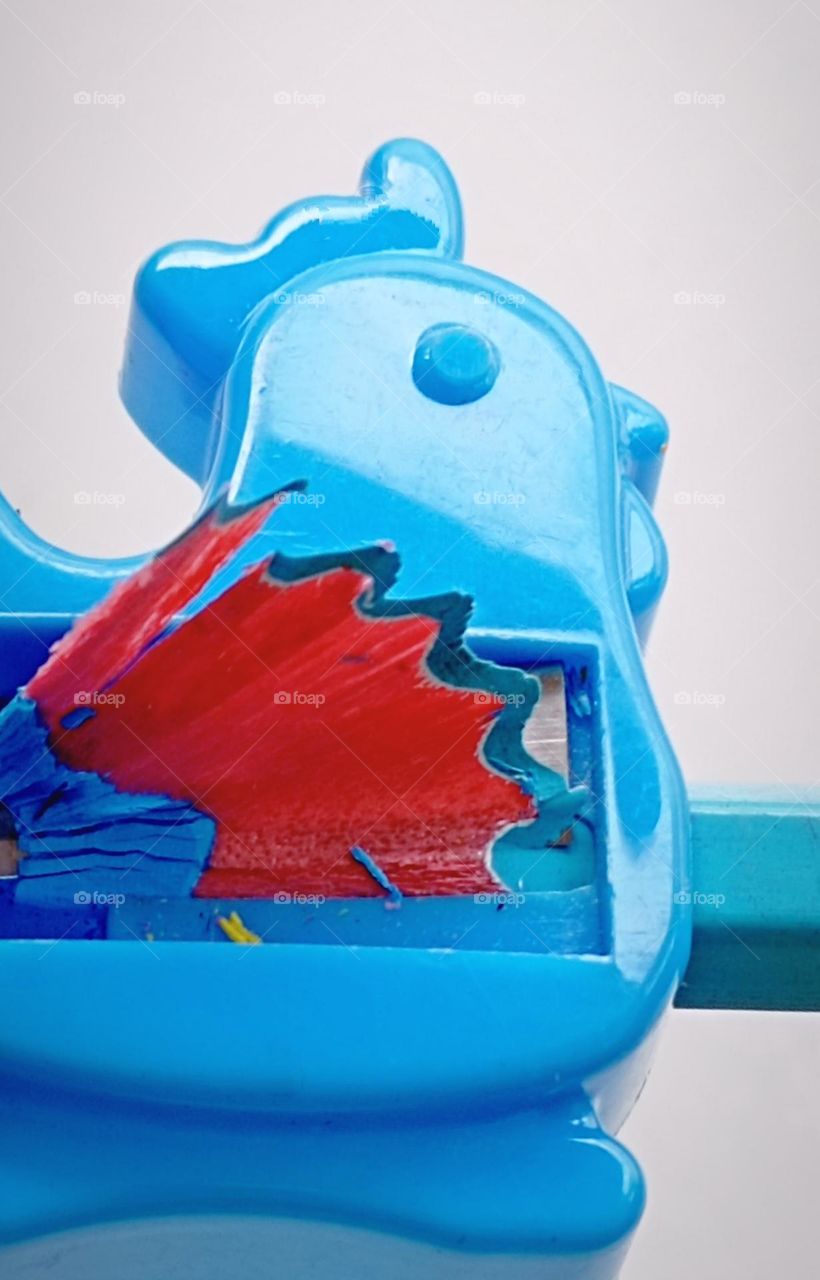 Sharpening a blue colour pencil...