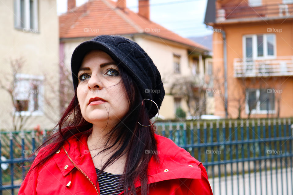 A woman in red looking away