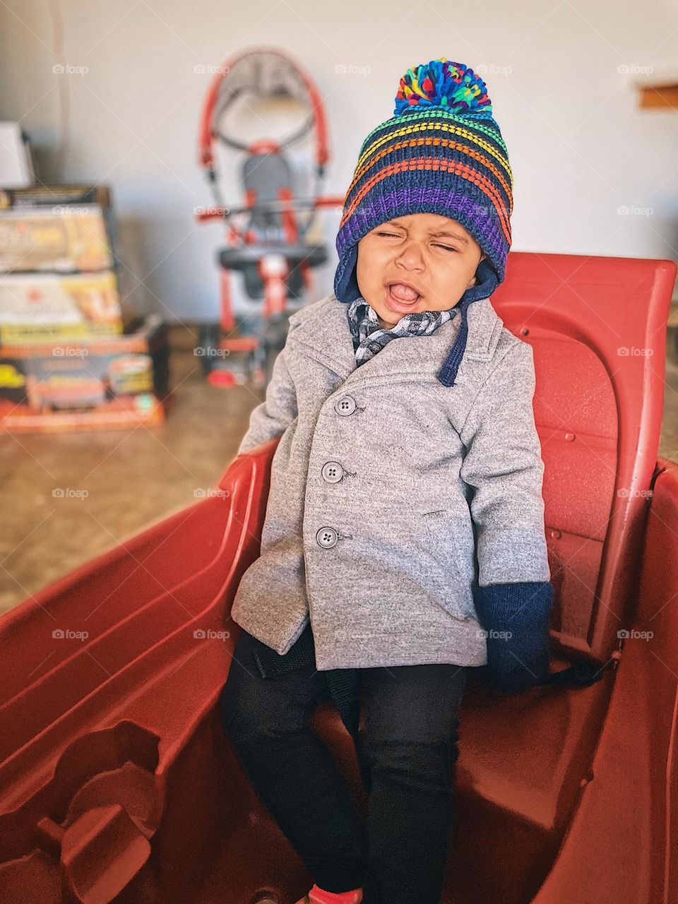 Baby girl is sad, baby is sad about wagon ride, baby girl is sad about wearing hat, baby shows emotion of sadness, baby showing emotions on face, facial expressions on toddlers, over dramatic baby girl, sad and cute baby girl