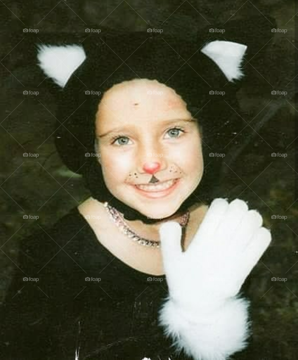 My daughter as a sweet kitty on Halloween.