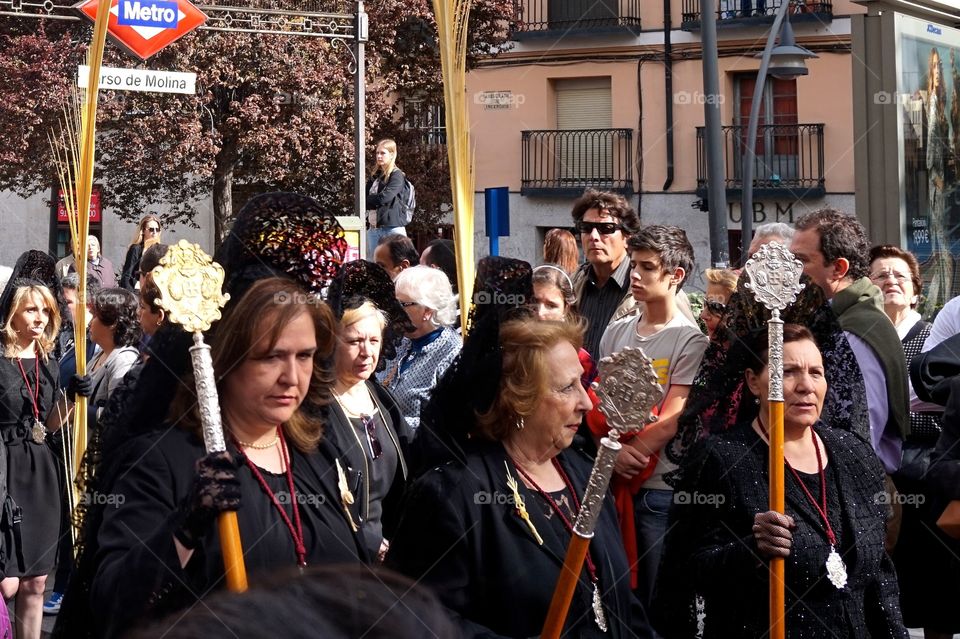 Ladies participating in a Semana Santa procession, Madrid, Spain 