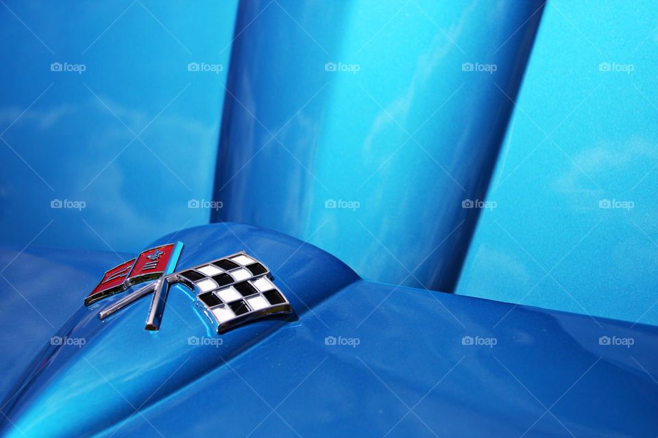 Corvette symbol on a blue car, very cool lines