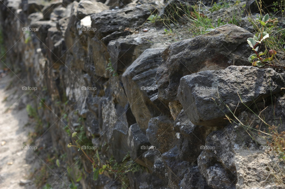 stone wall of Nevitsky castle, Ukraine