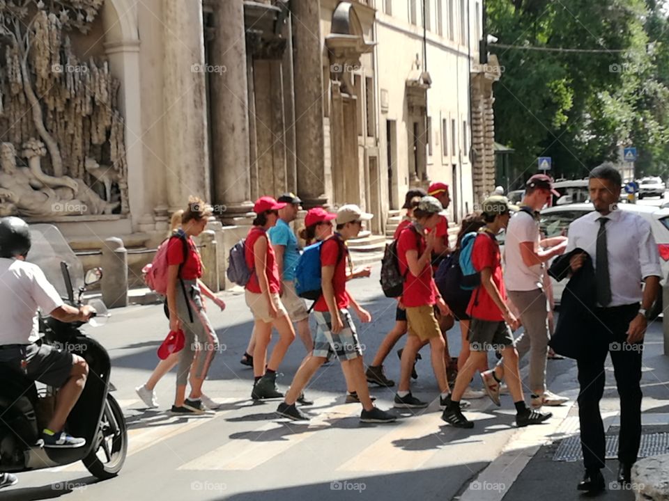 People walking in Rome.
