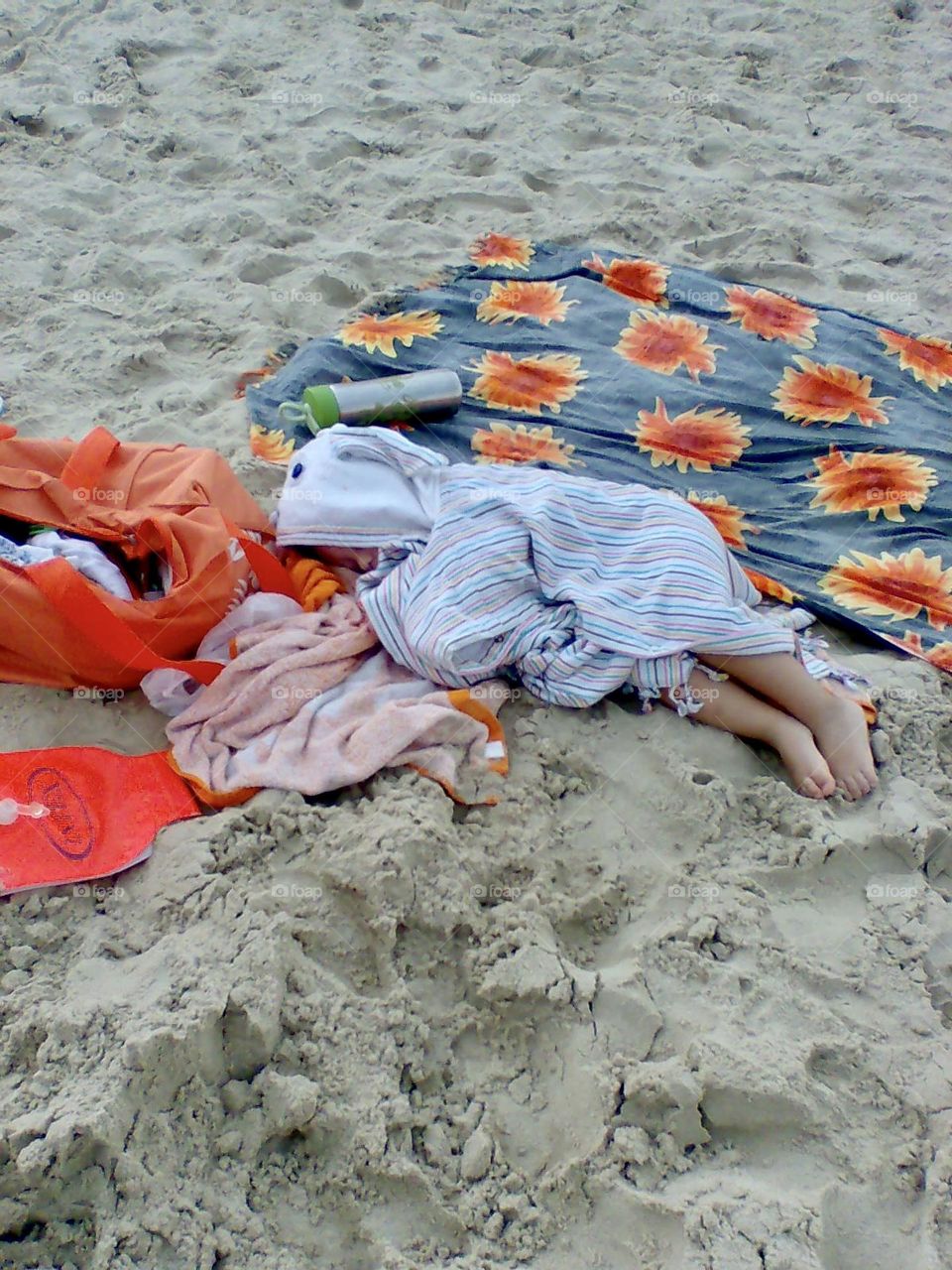 Baby sleep on the beach