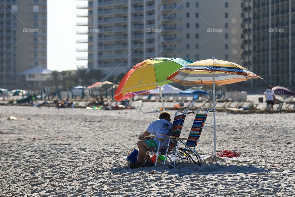 People leisure at the beach with Umbrella 