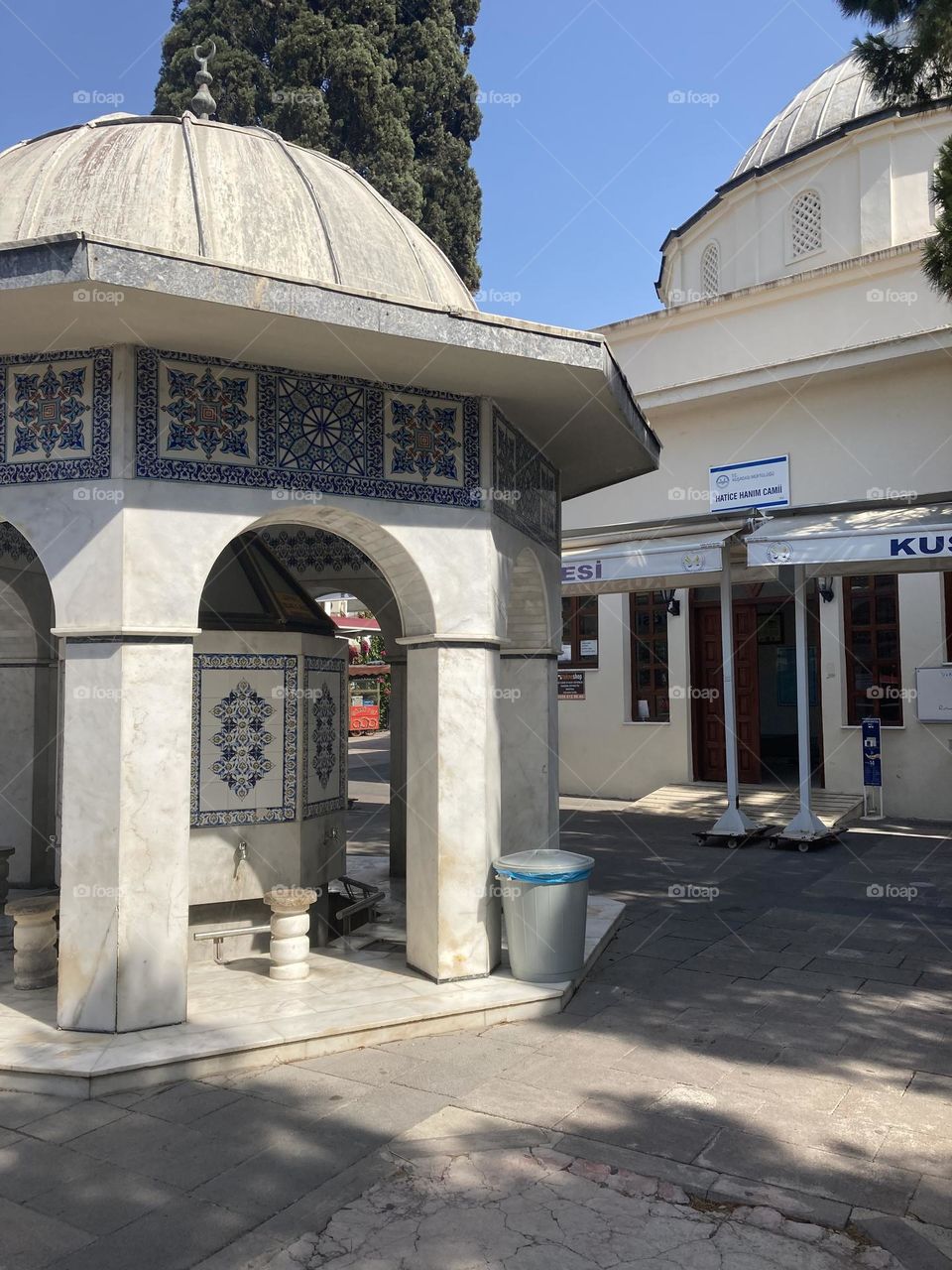 Sunny holidays I’m Turkey. Walk in the cute city and charming streets by the beach in Kusadasi. perfect blue sky and ocean view. Beach and the shore. To travel is to live. Gorgeous tall palm trees.