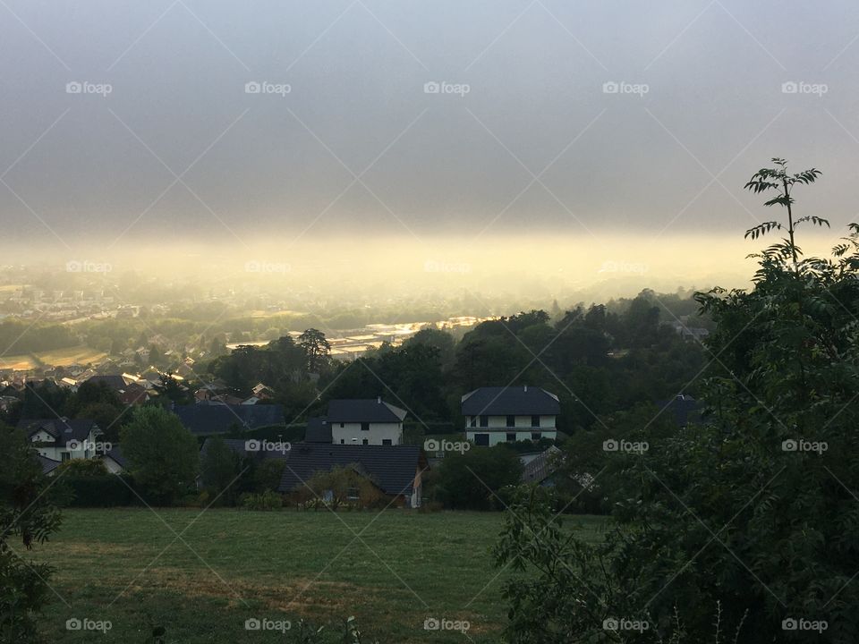 Sun and misty morning on valley