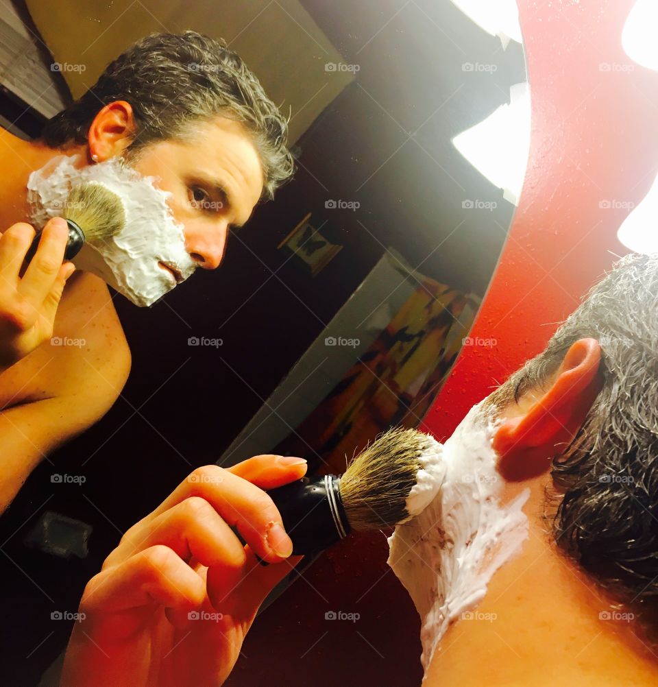 Shaving in the mirror 