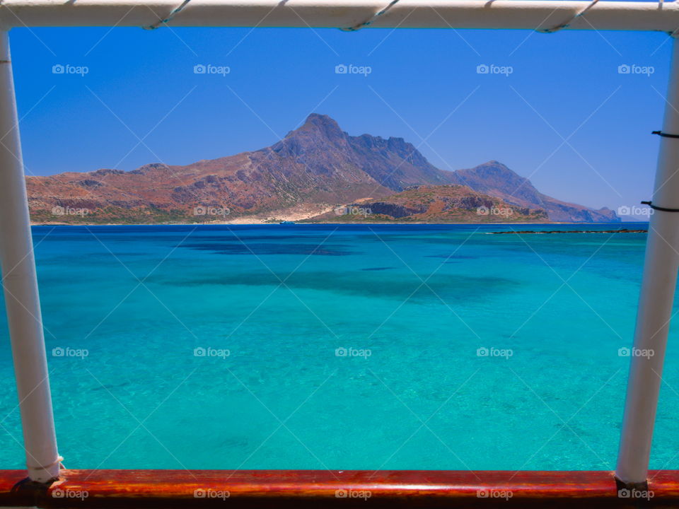 The Greek island of Gramvousa framed through the structure of the boat