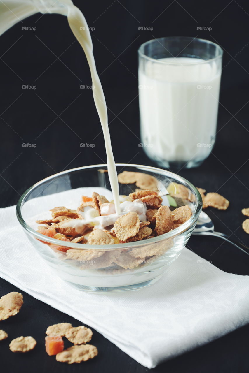 Muesli with milk. Muesli with milk on dark background