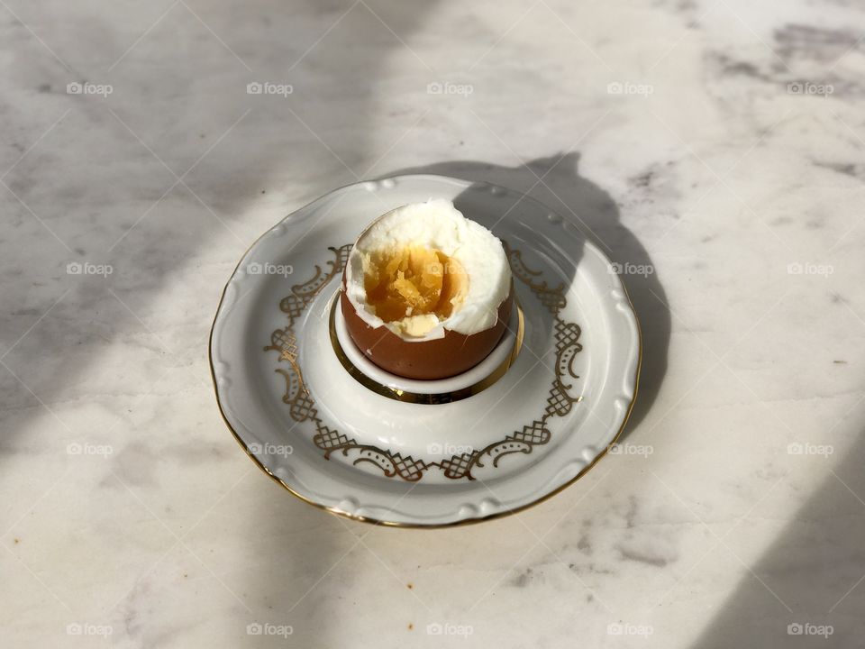 Served table boiled egg on marble table top view.