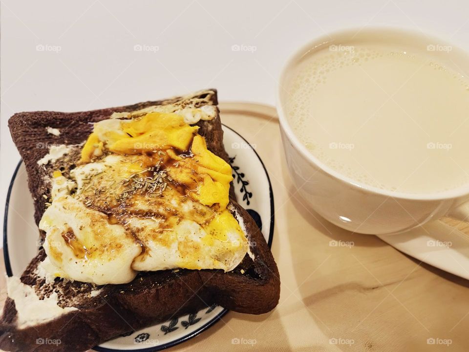 Dark chocolate toast with fried egg and soy milk