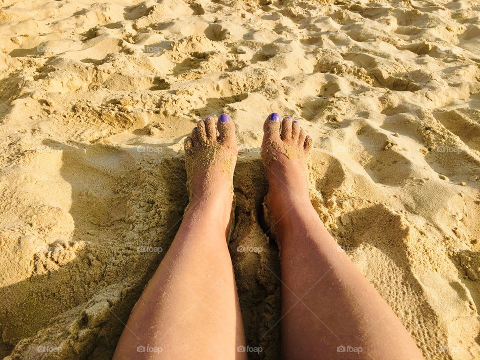 Feet of woman on beach 