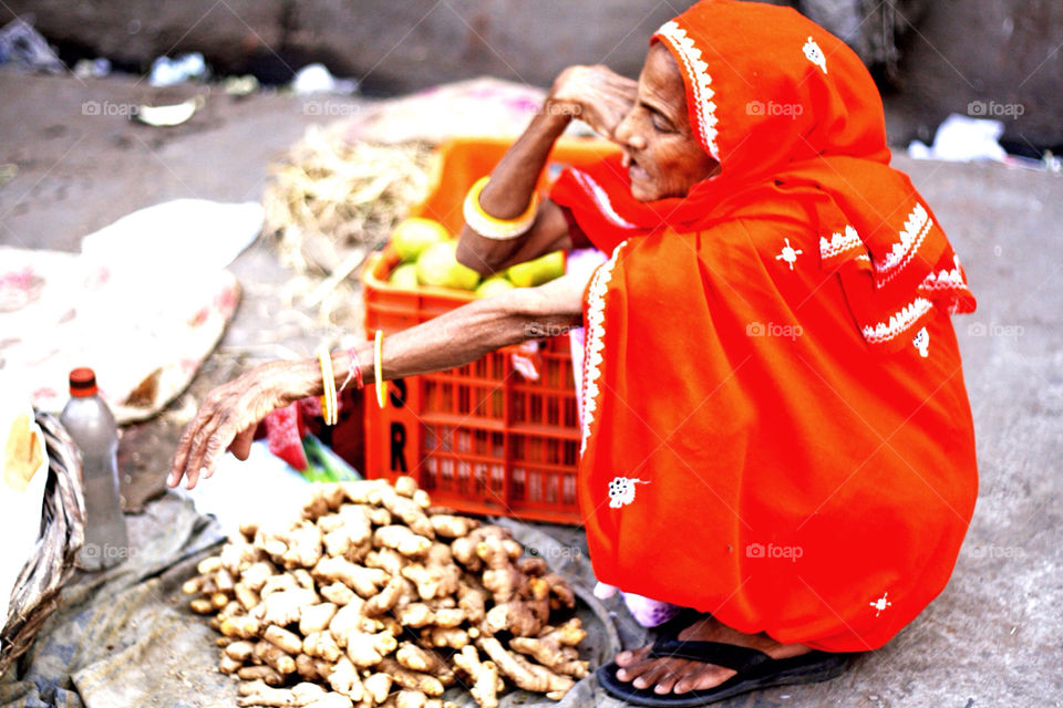 Merchant at a veggie market in Jaipur, India