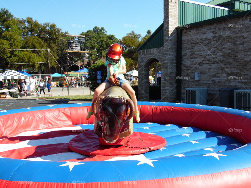 ride em cowgirl. This is a picture of a mechanical bull that was featured at the Oct festival. 👣 👣 🚶 🏃 🔥 💨