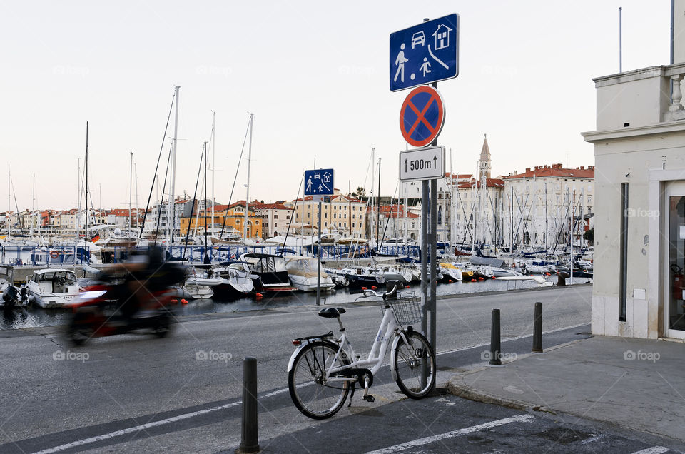 On bicycle at the empty streets of old town Piran at the Adriatic seaside in Slovenia. Healthy lifestyle.