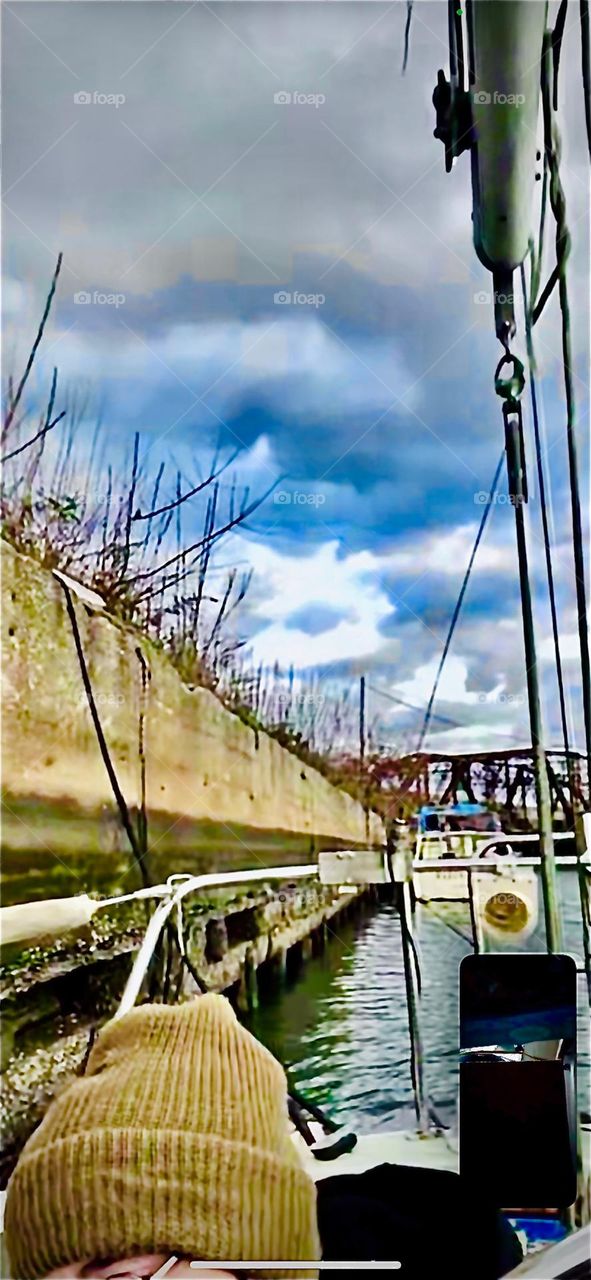 A dramatic cloudy sky over “Newtown Creek” near the “Pulaski Bridge” can be observed in Long Island City, Queens on a breezy cool Fall afternoon in 2022. Hypnotic Productions