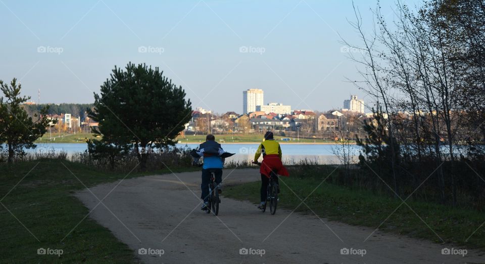 family riding on a bikes countryside