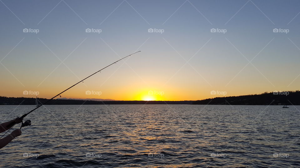 fishing at sunset