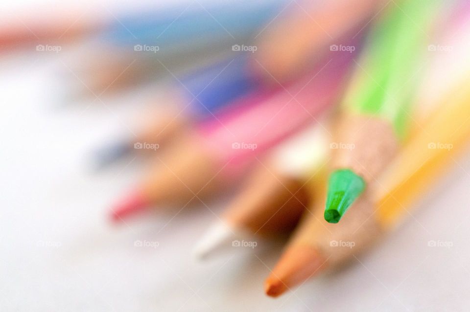 Colored pencil, focus on the green one