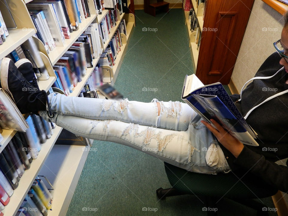 Girl Reading In The Library